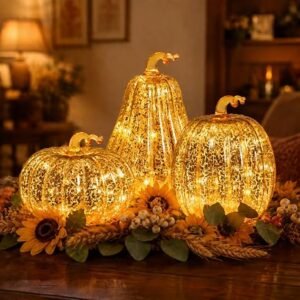 Set of 3 gold mercury glass pumpkin lights with LED warm glow for fall harvest home decor.
